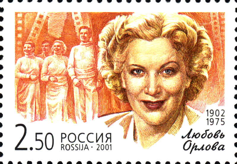 Stamp with face of attractive smiling woman on a background of actors including herself and strips of film